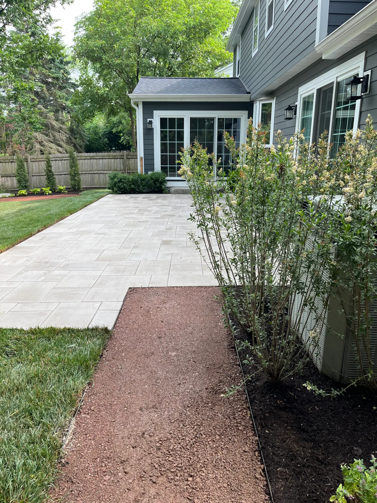 New paver patio, landscaping and restored lawn after a Hinsdale backyard renovation